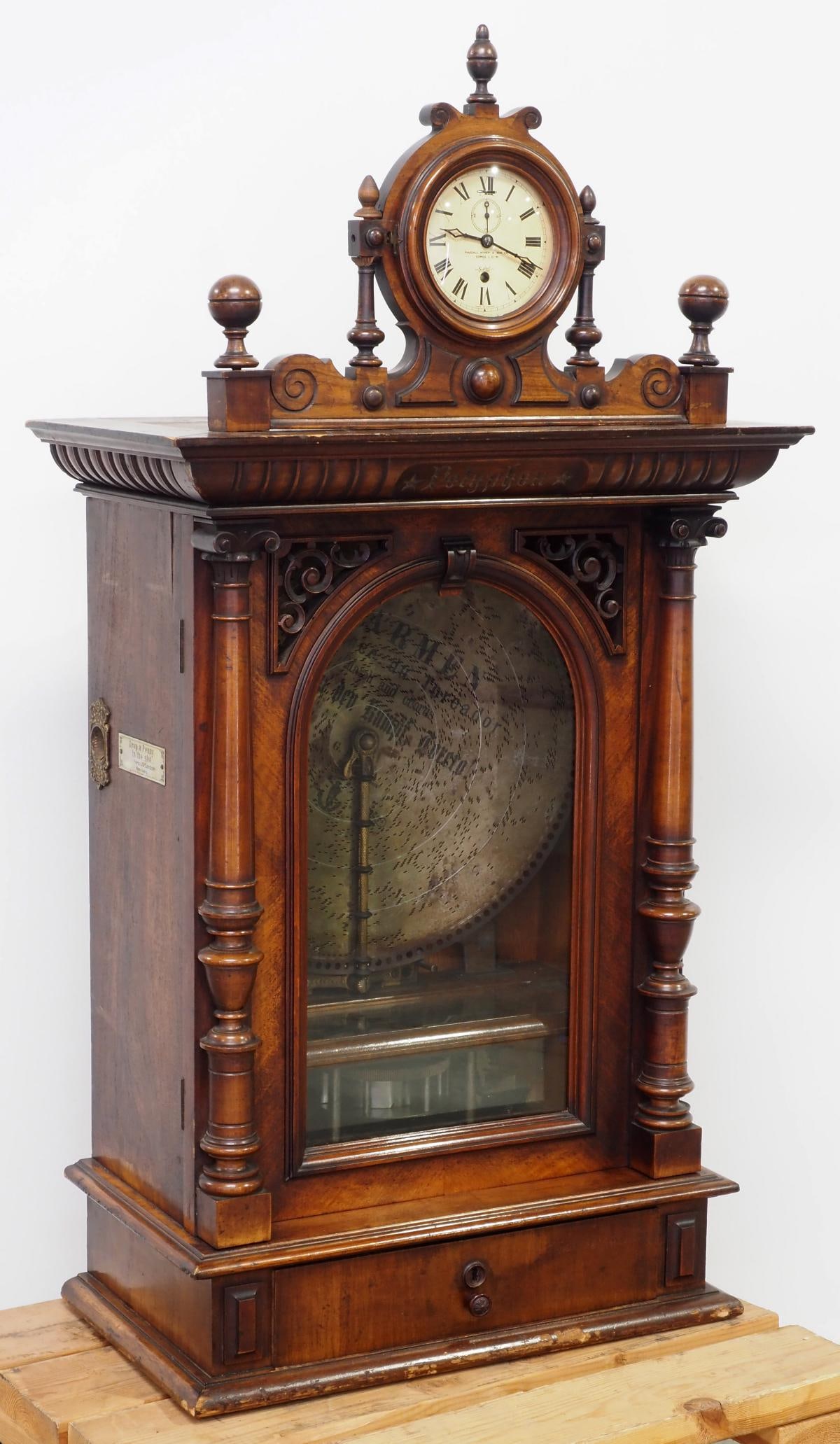 Table-top 19th Century Clock Top Coin-Operated Polyphon 104U Music Box: Table-top 19th Century Clock Top Coin-Operated, Double Comb Polyphon 104U Music Box in European Walnut Case, Made in Leipzig by H. Peters & Co., London, plays with large penny from England, 19.5" disc
