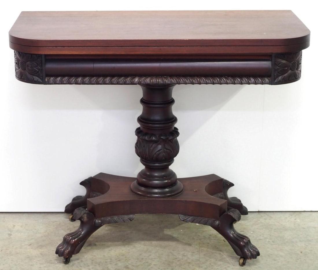 Mahogany Empire-style Flip-top Game Table with Acanthus Carved Pedestal Base: Mahogany Empire-style Flip-top Game Table with Acanthus Carved Pedestal Base and Claw Feet Below Veneered Plinth (measurement folded) Condition NOTICE! VERY IMPORTANT! Chupp Auctions is pleased to iss
