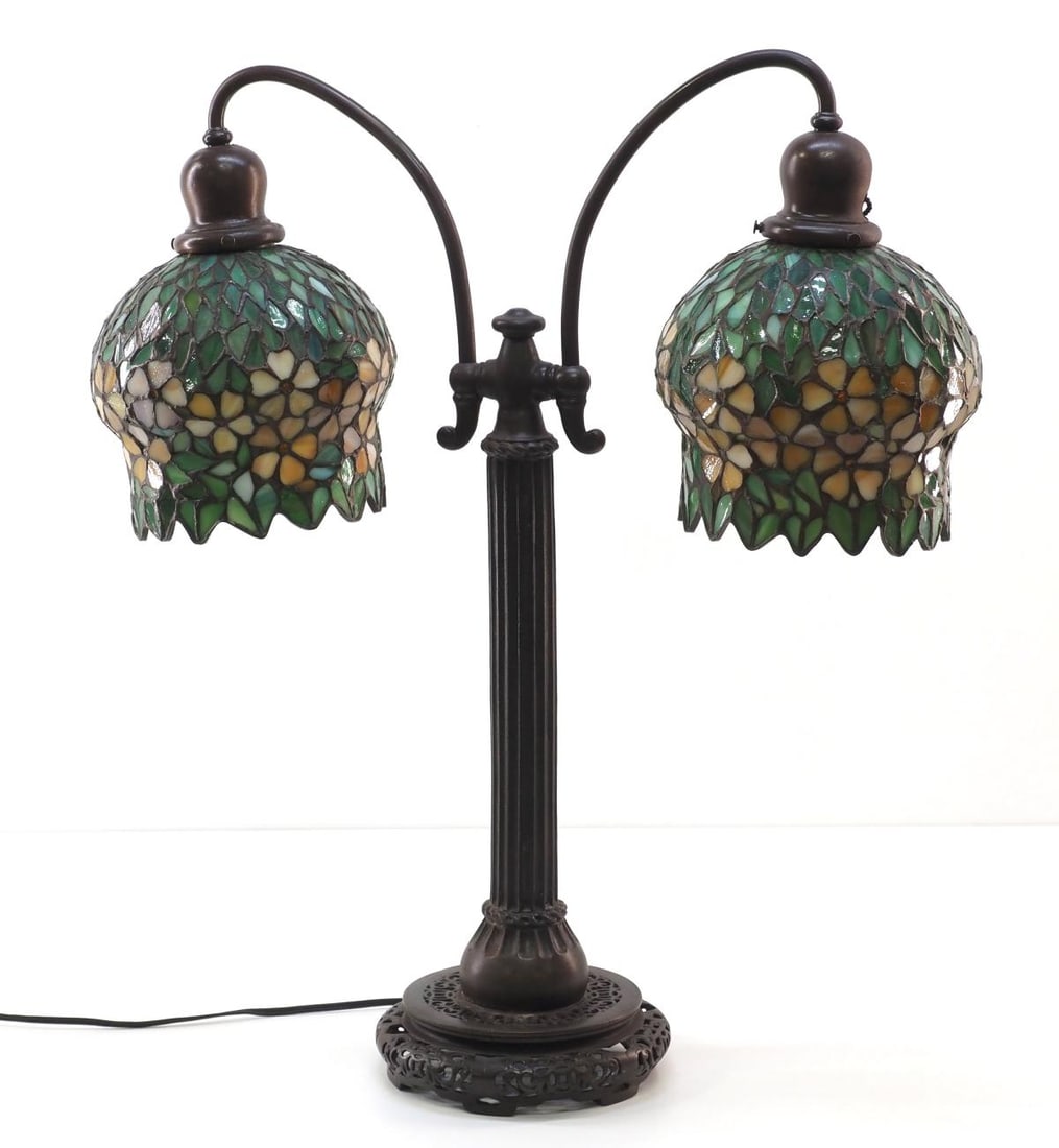 Handel Double Arm Student Lamp with Leaded Glass Shades: Handel Double Arm Student Lamp with Leaded Glass Shades and Patinaed Metal Base Condition NOTICE! VERY IMPORTANT! Chupp Auctions is pleased to issue an opinion on any lot; the absence of a condition r