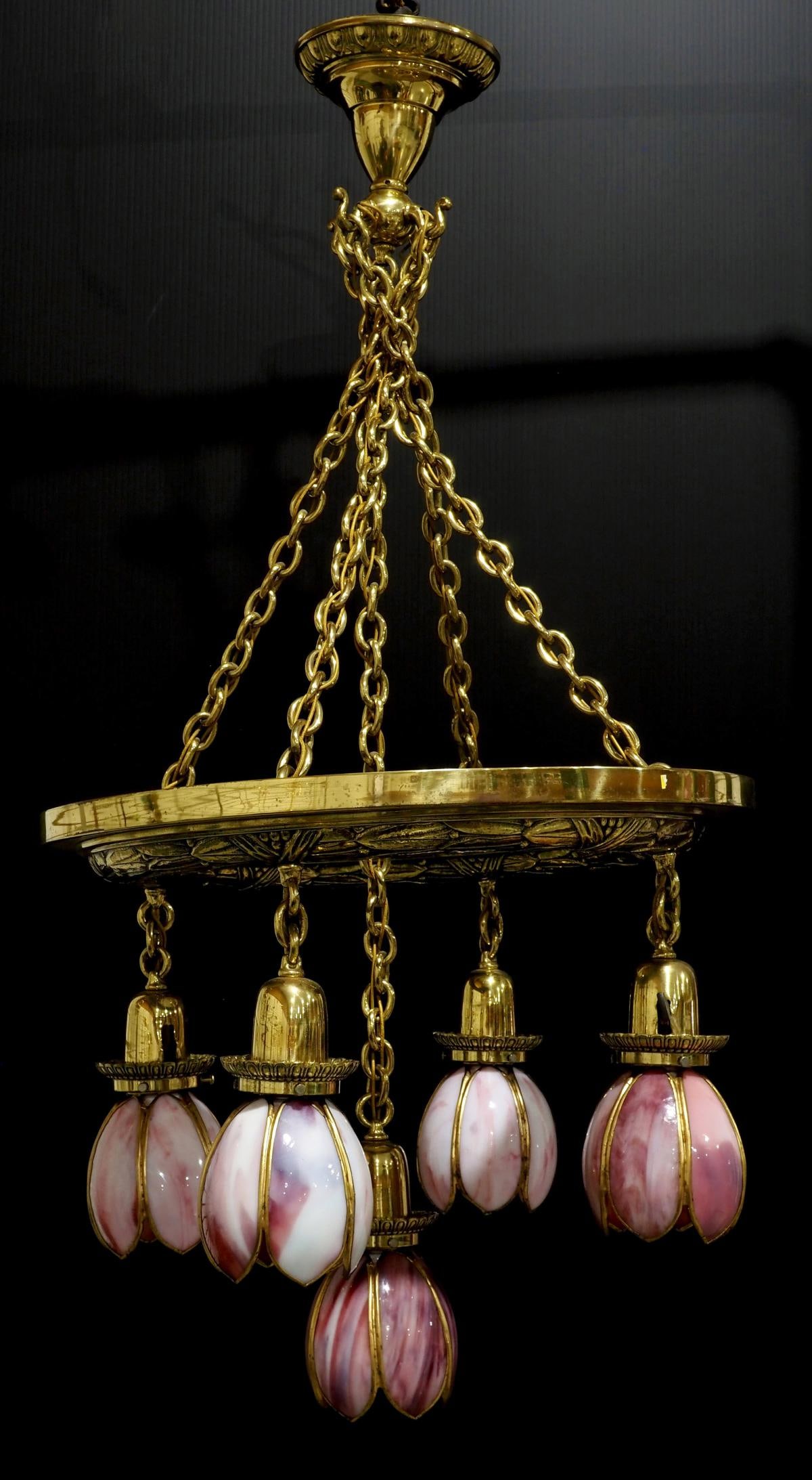 Cast Brass Arts & Crafts Chandelier with 5 Tulip Pink Slag Paneled Shades: Cast Brass Arts & Crafts Chandelier with 5 Tulip Pink Slag Paneled Shades Condition NOTICE! VERY IMPORTANT! Chupp Auctions is pleased to issue an opinion on any lot; the absence of a condition report 