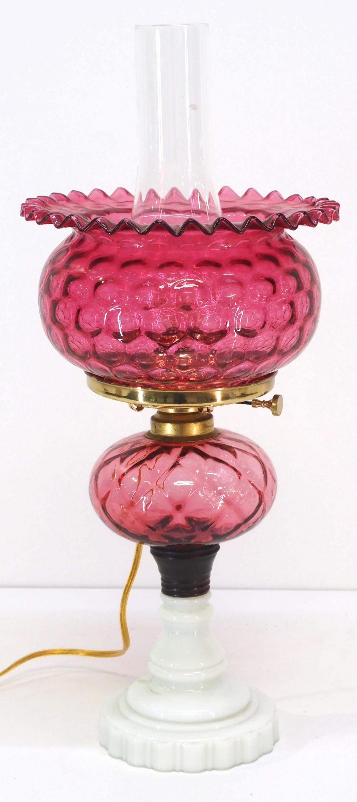 Cranberry Ruffled Coin Dot Parlor Lamp with Milk Glass Base: Cranberry Ruffled Coin Dot Parlor Lamp with Milk Glass Base, can be converted back to original oil Condition NOTICE! VERY IMPORTANT! Chupp Auctions is pleased to issue an opinion on any lot; the absen