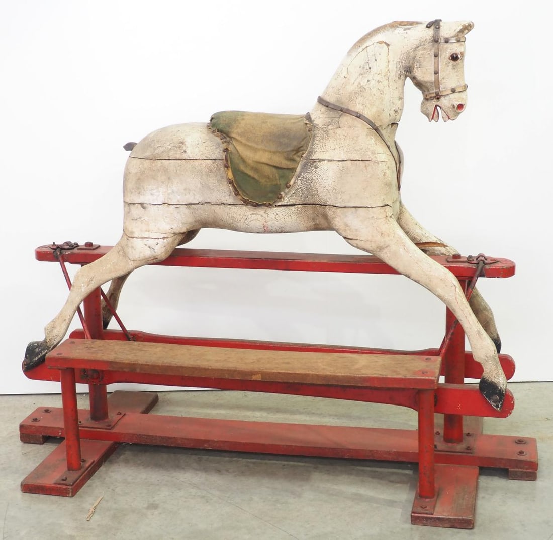 Very early wooden riding horse: Very early wooden riding horse with glass eyes and lots of original paint, on base with step, horse is 50"L, overall 46"H