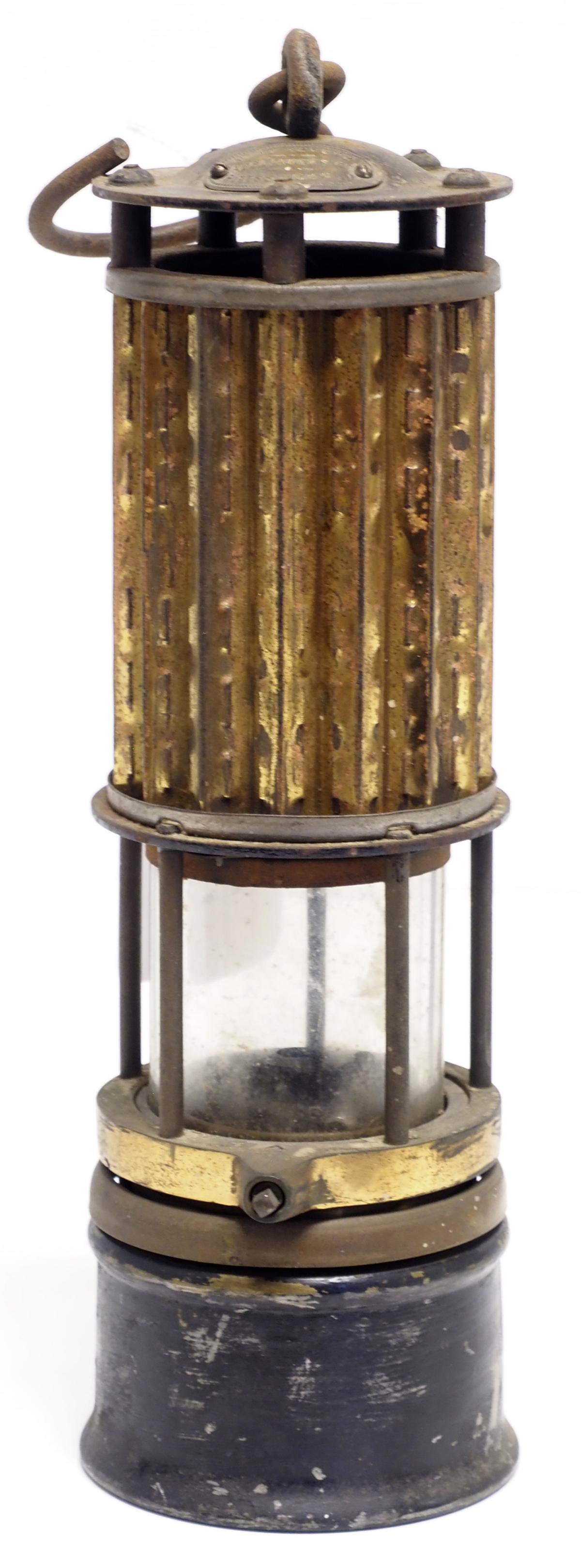 Miner's lamp by Mine Safety Appliances: Miner's lamp by Mine Safety Appliances Co. with brass tags, 11.5"H