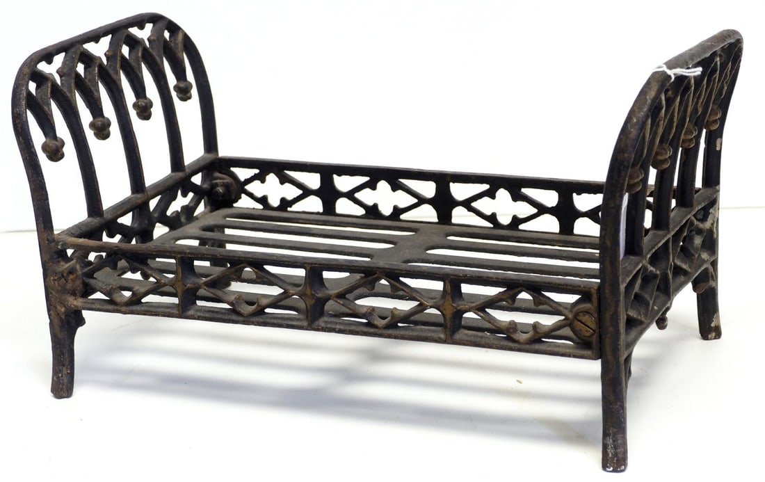 Cast iron child's toy bed: Cast iron child's toy bed, 16"L x 8.5"W x 8"H - small crack in mattress support Condition small crack in mattress support