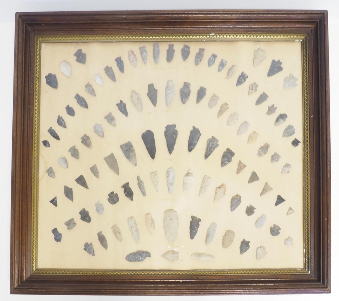 Frame of Indian arrowheads: Frame of Indian arrowheads from different counties in Ohio, 32"x26", largest measures 3"H