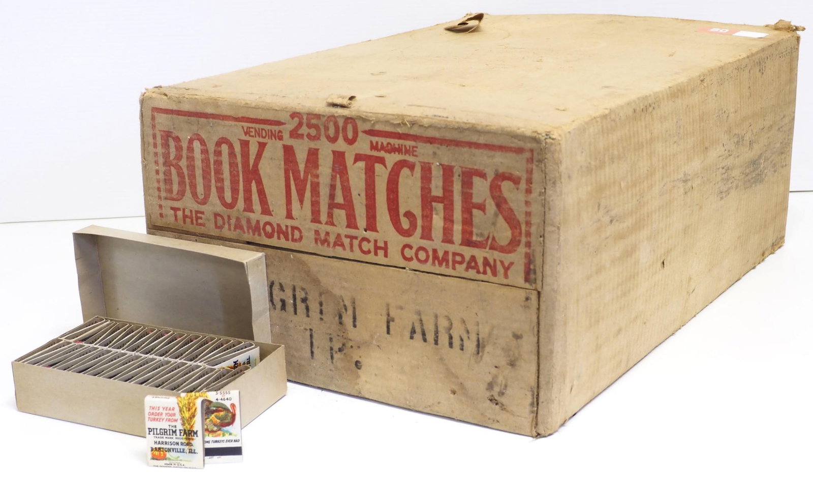 NOS Diamond Match Company matchbooks: Full box of NOS Diamond Match Company matchbooks for the Pilgrim Farm, Bartonville, ILL