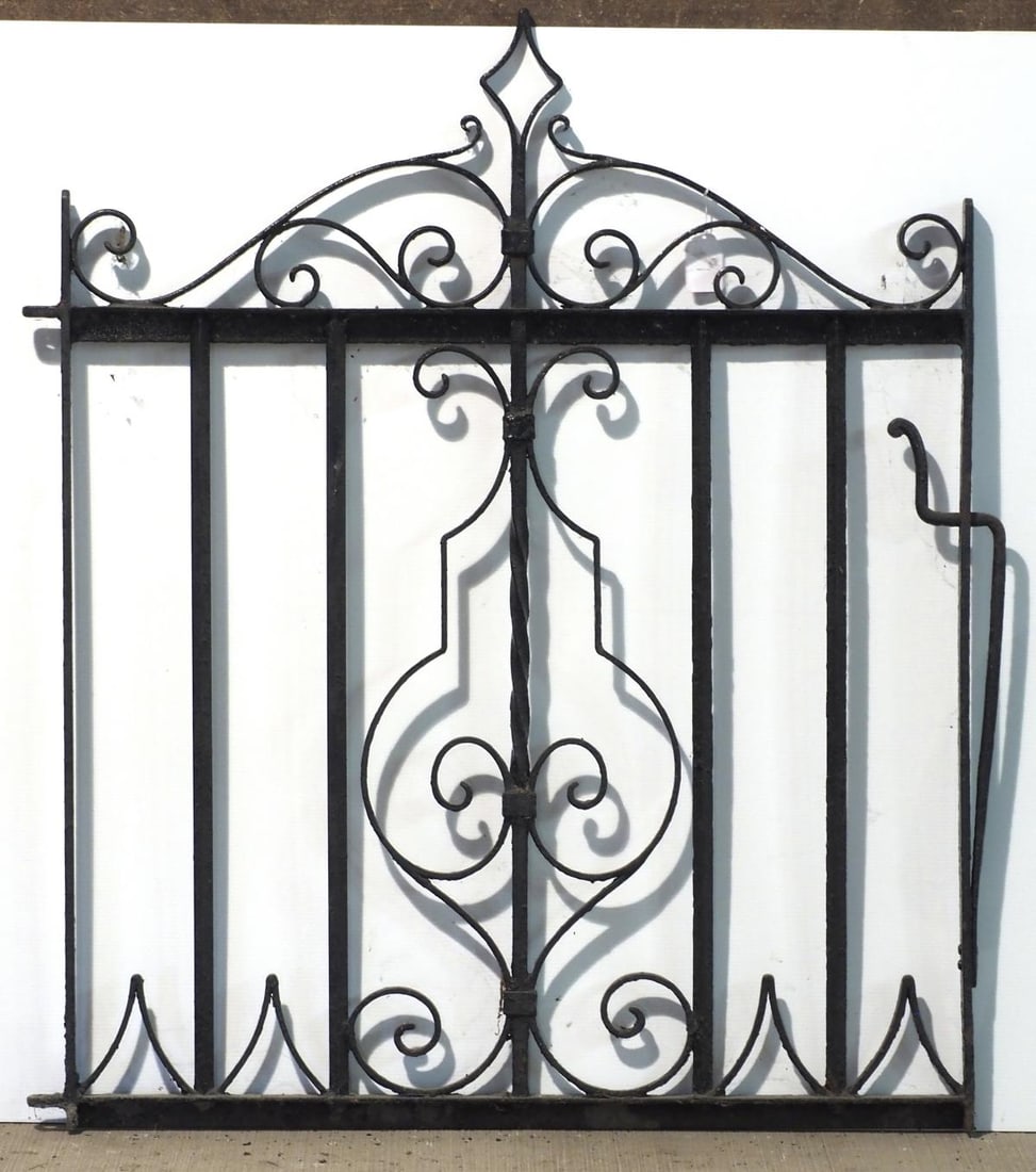 Ornate cast iron fence gate (1 of 2)