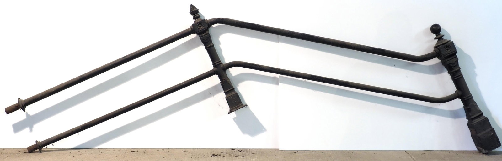 2-pc cast iron hand rail with pineapple finials: 2-pc cast iron hand rail with pineapple finials, center posts are 33"H, 140"L for shipping - center post bases have chips * * NOT ELIGIBLE FOR IN-HOUSE SHIPPING. Please contact the auction house for