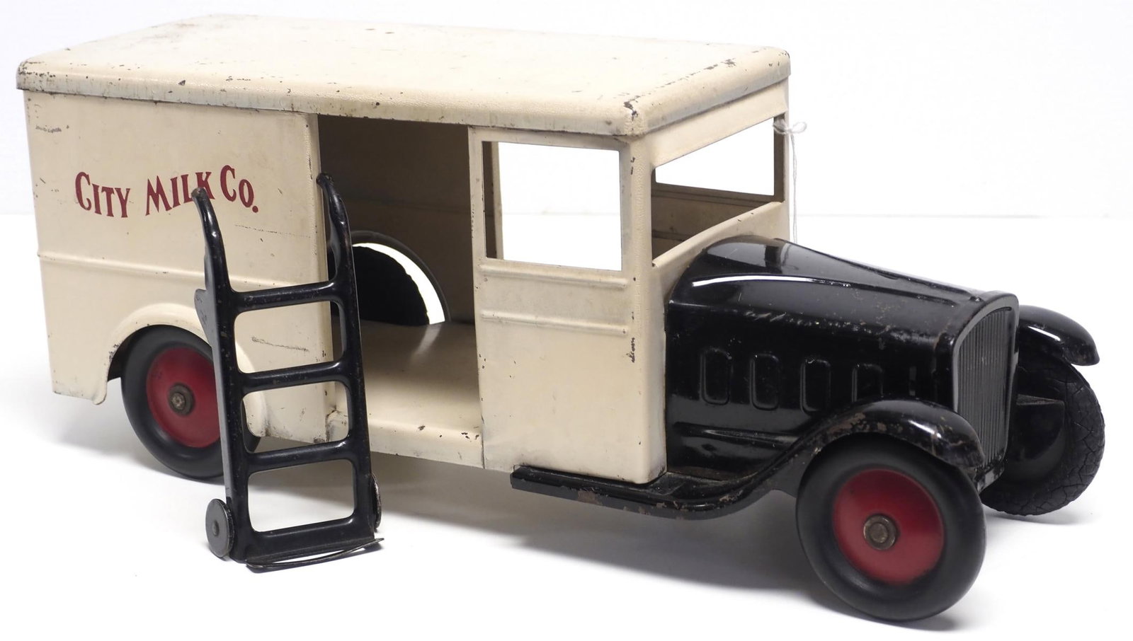 Steelcraft City Milk Co. delivery truck: Steelcraft City Milk Co. pressed steel delivery truck with 2-wheel hand truck, 18"L - Good Condition Good