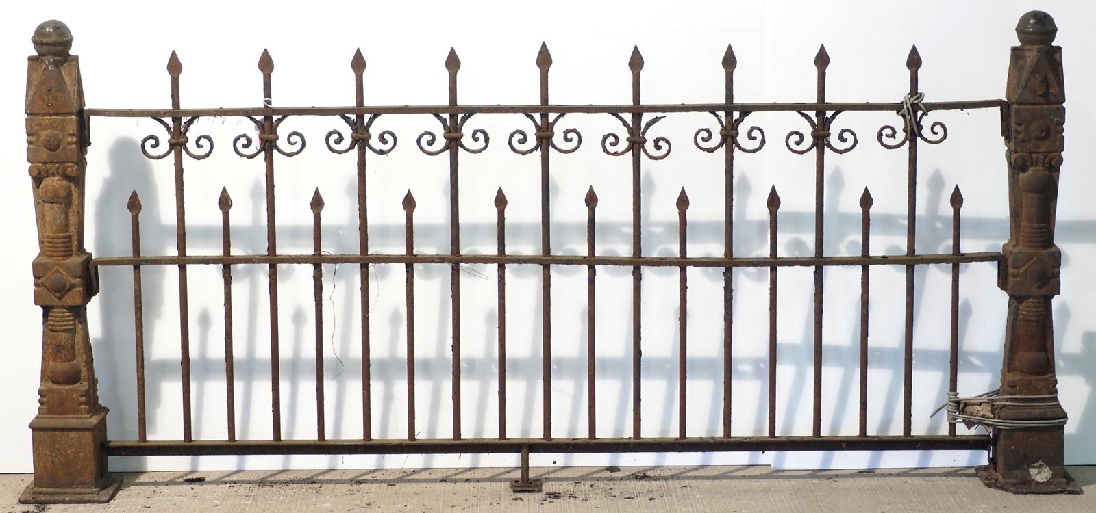 Section of cast iron fence with posts: Section of cast iron fence with posts, 81"L and 39"H posts - top rail rusted out in spots, base has chip * * NOT ELIGIBLE FOR IN-HOUSE SHIPPING. Please contact the auction house for transport options