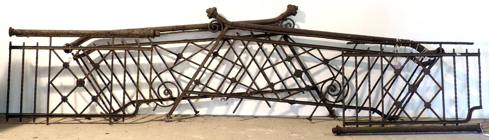 Ornate 4-pc cast iron stairway rail set: Ornate 4-pc cast iron stairway rail set with lions heads on ends of rails! WOW! (2) 80" stair rails & (2) 48" sections - one section has pipe detached * * NOT ELIGIBLE FOR IN-HOUSE SHIPPING. Please