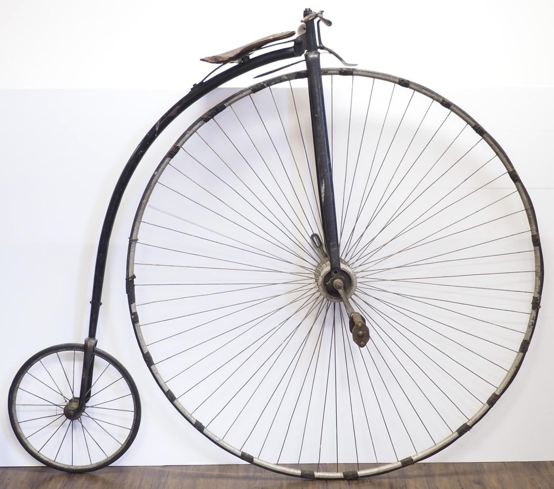 19th Century American Rudge high-wheel bike: 19th Century American Rudge high-wheel bike with leather seat, front wheel 52"dia, rear wheel 17.5"dia. - missing one handle and one pedal, rubber has been taped * * NOT ELIGIBLE FOR IN-HOUSE SHIPPING