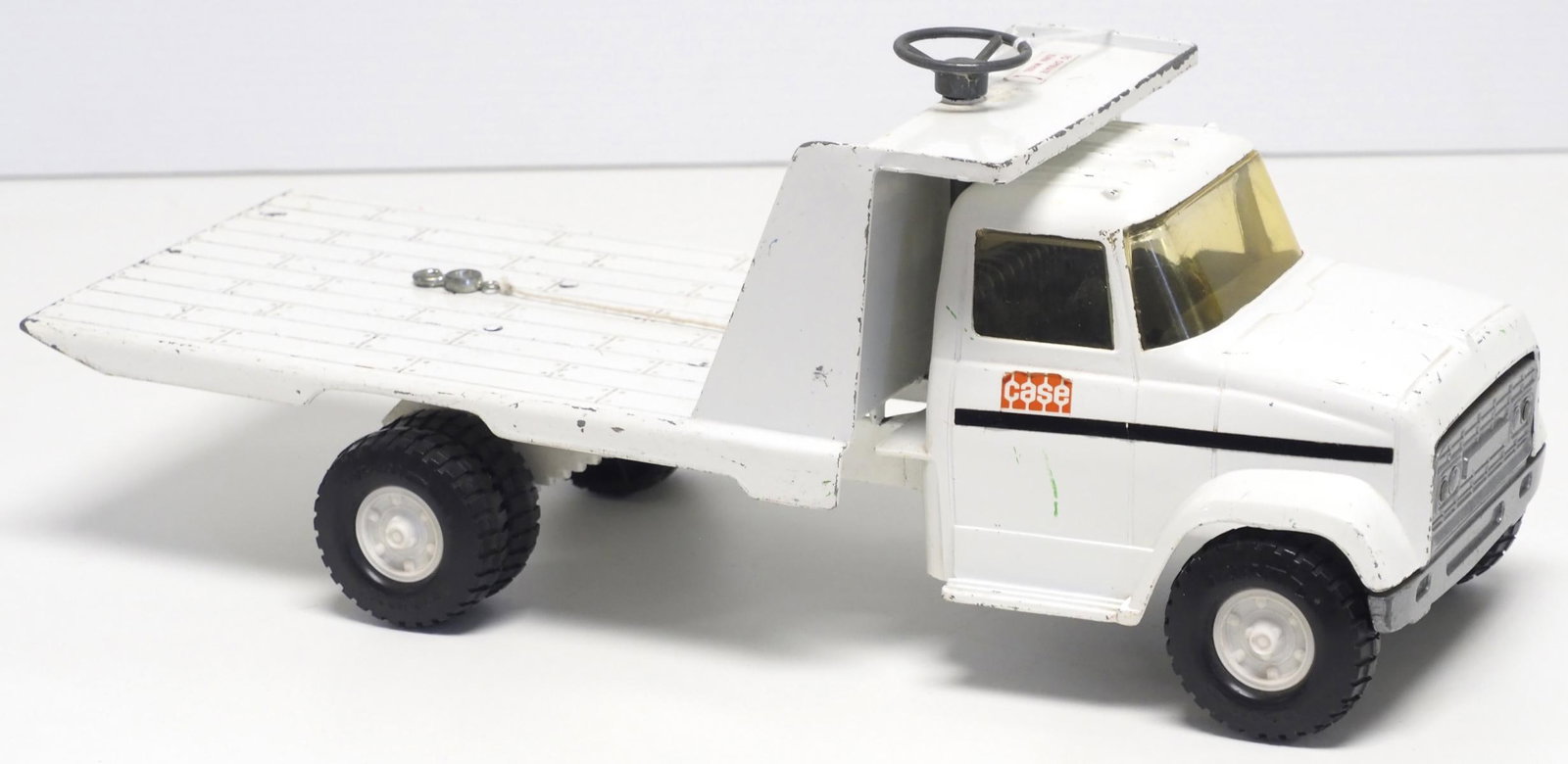 Ertl Case Flatbed Truck with winch: Ertl Case pressed steel Flatbed Truck with winch - Good Condition Good