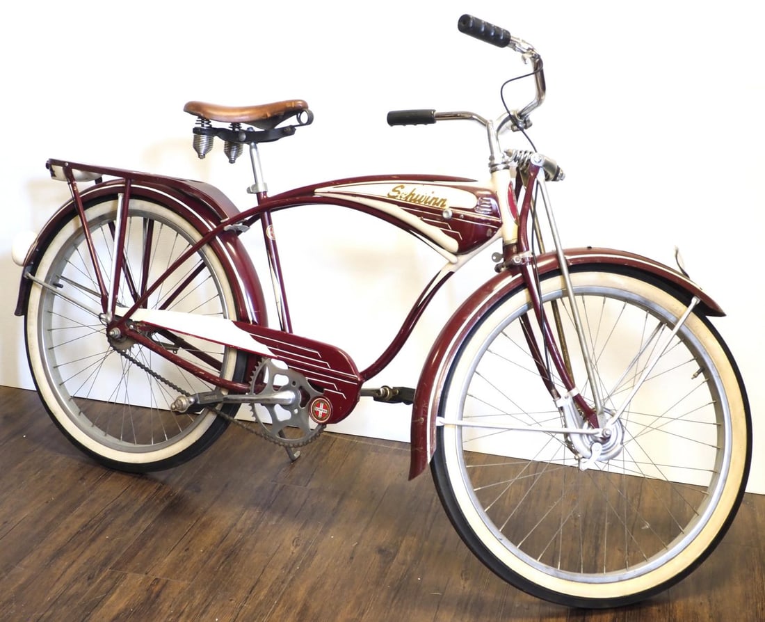 Early Schwinn B6 Autocycle: Early Schwinn B6 Autocycle in maroon and cream with battery headlight and spring fork * * NOT ELIGIBLE FOR IN-HOUSE SHIPPING. Please contact the auction house for transport options and additional deta