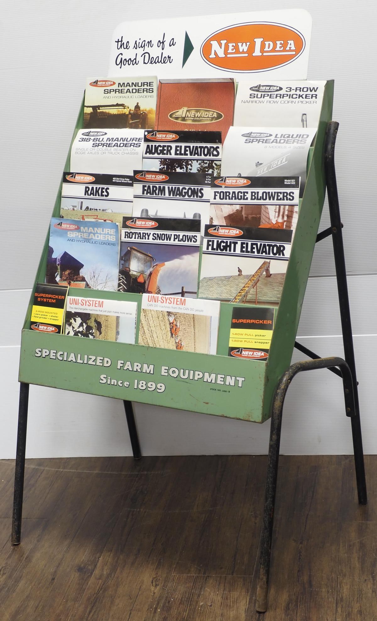 New Idea metal brochure rack full of brochures: New Idea metal brochure rack full of brochures, 27"x20"x48"H * * NOT ELIGIBLE FOR IN-HOUSE SHIPPING. Please contact the auction house for transport options and additional details. Items must be