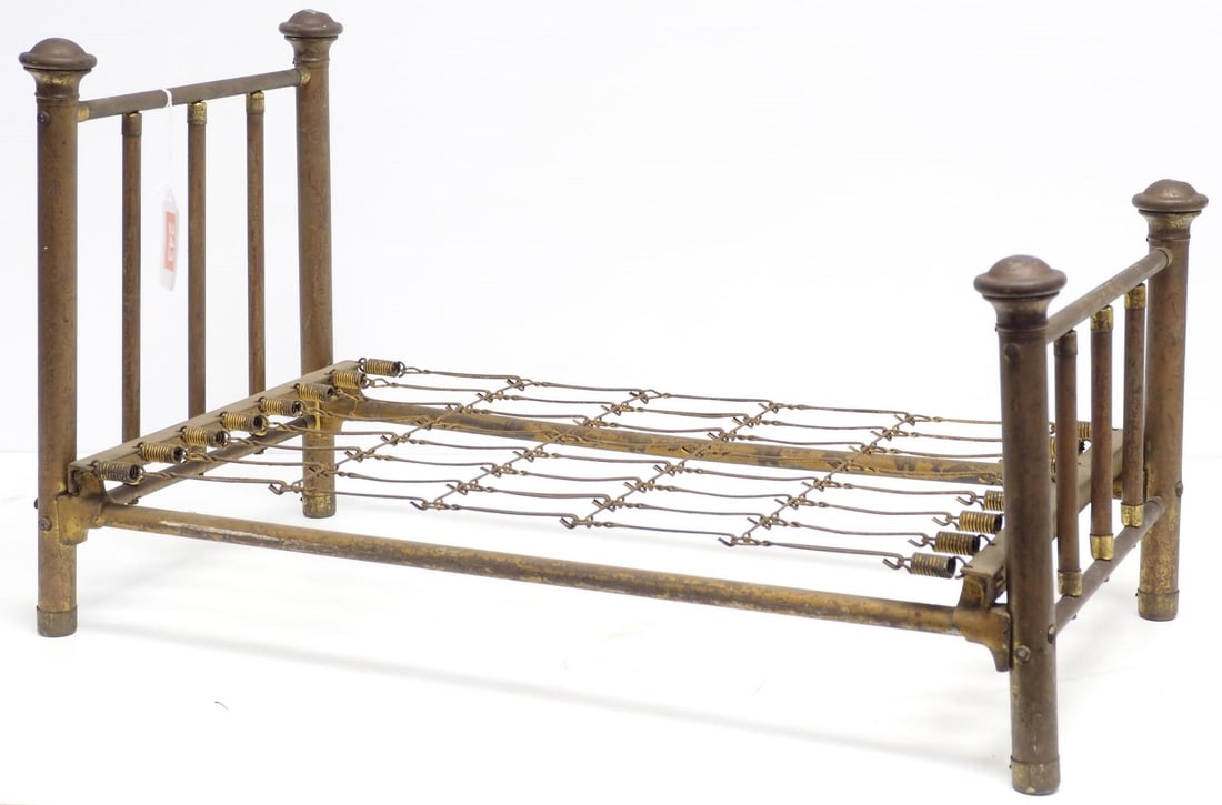 Child's toy brass doll bed (1 of 2)