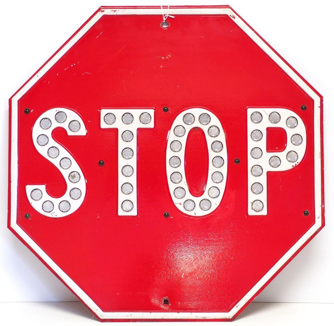 STOP sign with reflective cat-eyes: 24"x24" heavy metal STOP sign with reflective cat-eyes