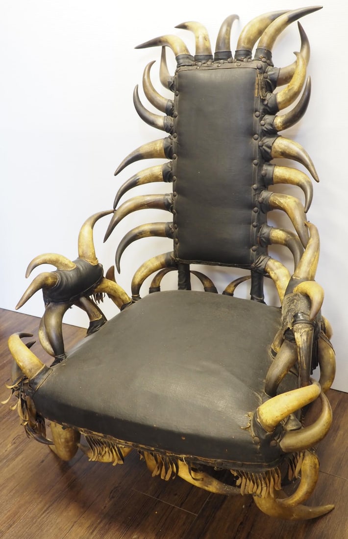 Custom-made horn chair: Custom-made horn chair, 31"W x 23"D x 41"H - horn on arm rest very loose * * NOT ELIGIBLE FOR IN-HOUSE SHIPPING. Please contact the auction house for transport options and additional details. Items