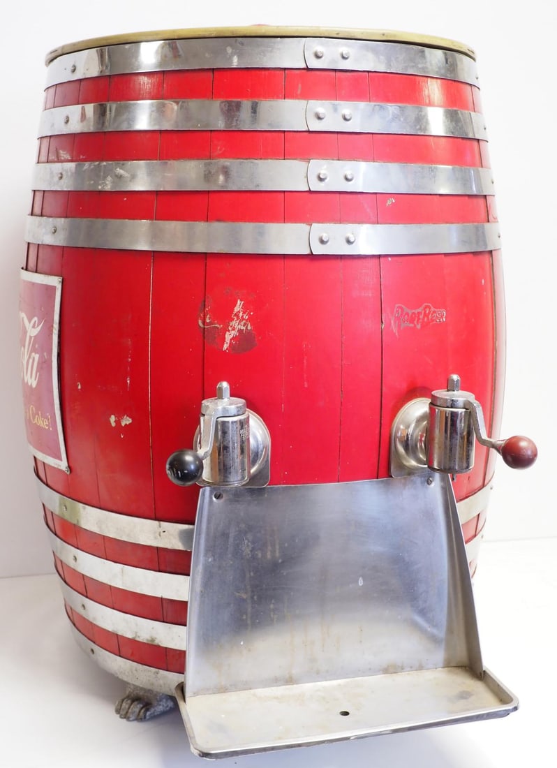 Coca Cola wooden dispenser barrel: Coca Cola wooden dispenser barrel with 2 spigots and 3 claw feet, 33"H x 24"dia. - Good * * NOT ELIGIBLE FOR IN-HOUSE SHIPPING. Please contact the auction house for transport options and