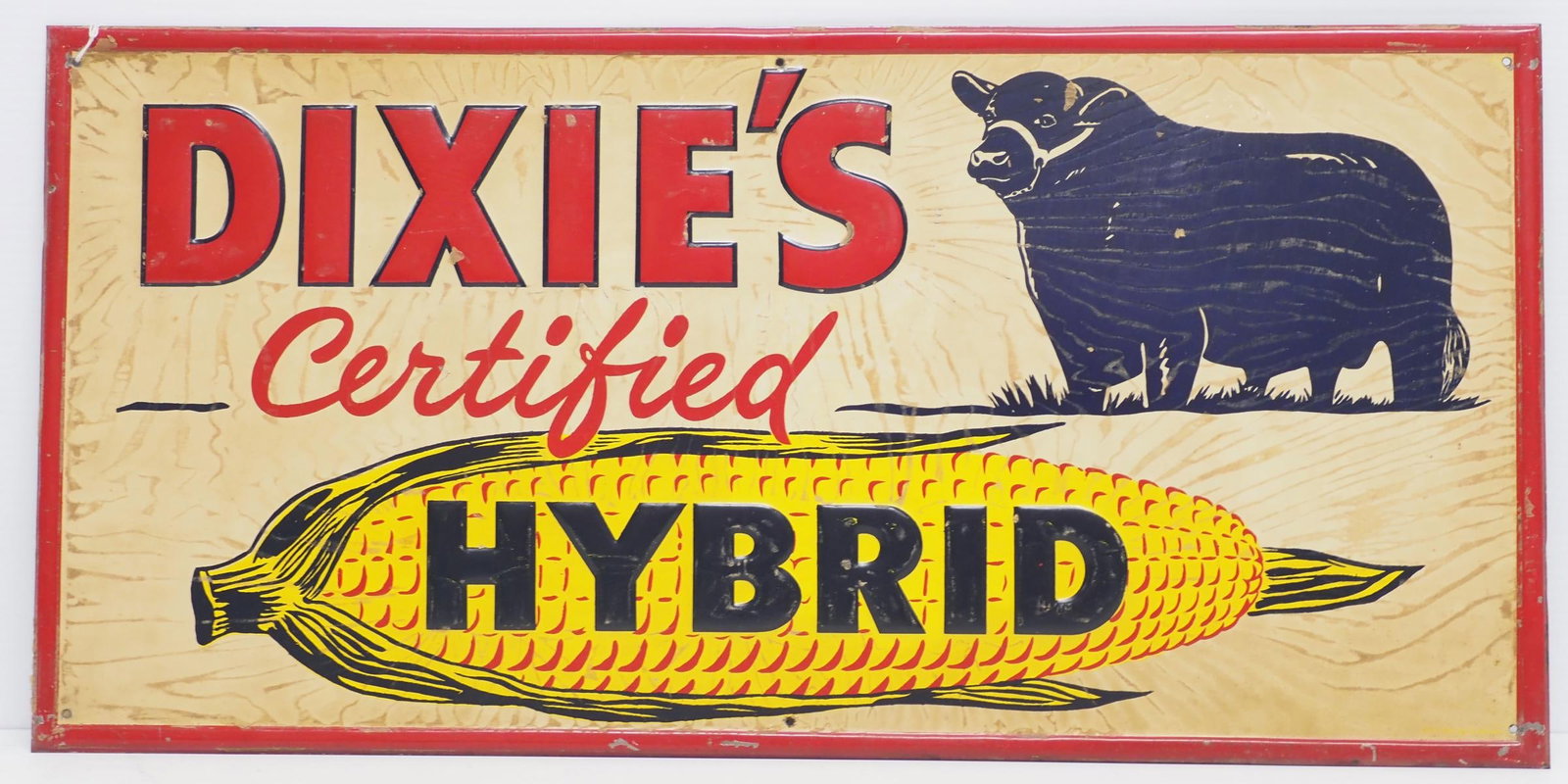 Dixie's Certified Hybrid sign: 23.5"x11" SST embossed Dixie's Certified Hybrid sign depicting Black Angus bull - Very Good Condition Very Good