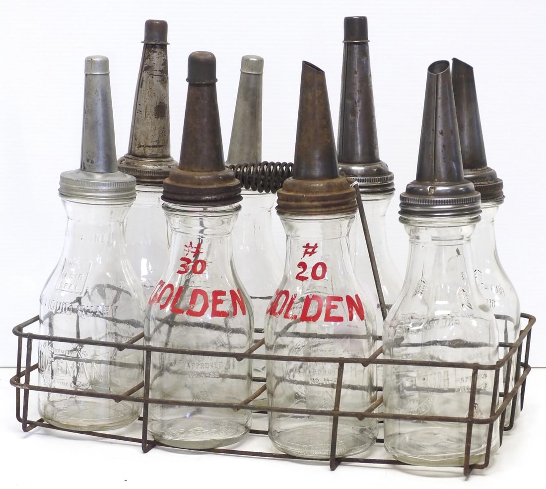 Wire oil bottle carrier and Huffman oil bottles: Wire oil bottle carrier and (8) glass Huffman oil bottles with spouts