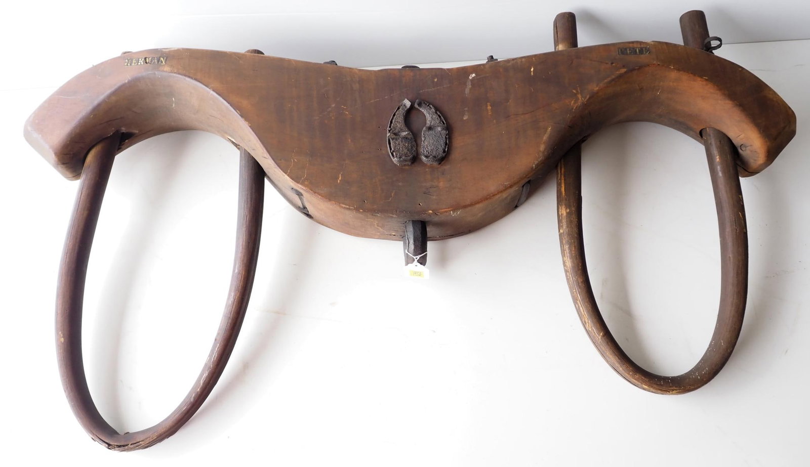 Wooden ox yoke with pair of ox shoes: Wooden ox yoke with pair of ox shoes, 55"L * * NOT ELIGIBLE FOR IN-HOUSE SHIPPING. Please contact the auction house for transport options and additional details. Items must be picked up within 10