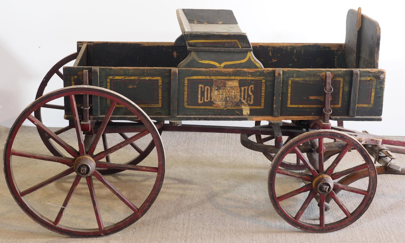 Columbus goat wagon - WOW!: Columbus goat wagon with pull handle, shafts and very good original paint and stenciling, WOW! * * NOT ELIGIBLE FOR IN-HOUSE SHIPPING. Please contact the auction house for transport options and additi