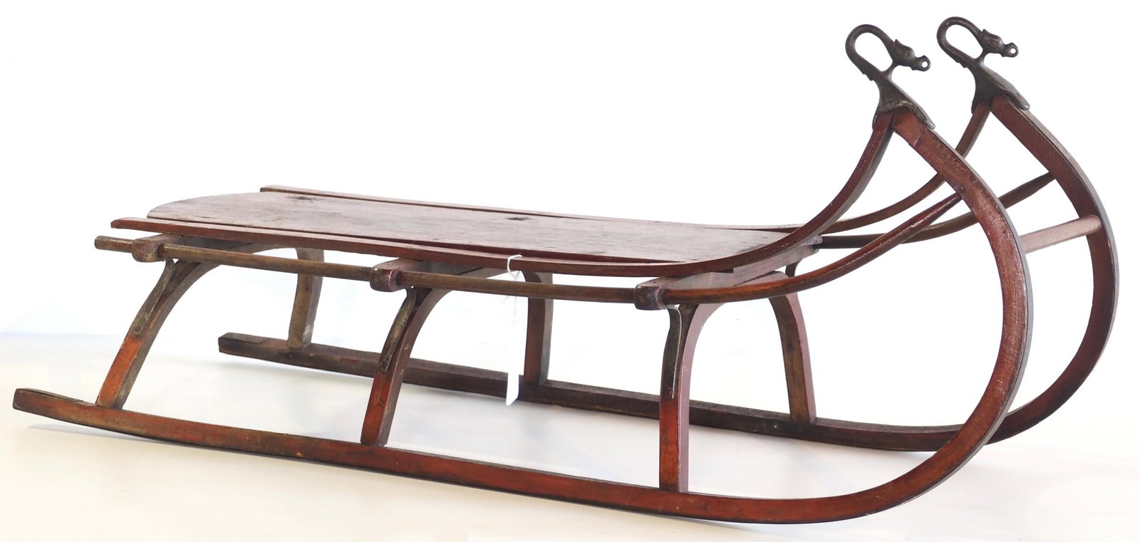 Wooden child's sled: Wooden child's sled with with stenciling of a dog and decorative runner ends * * NOT ELIGIBLE FOR IN-HOUSE SHIPPING. Please contact the auction house for transport options and additional details.