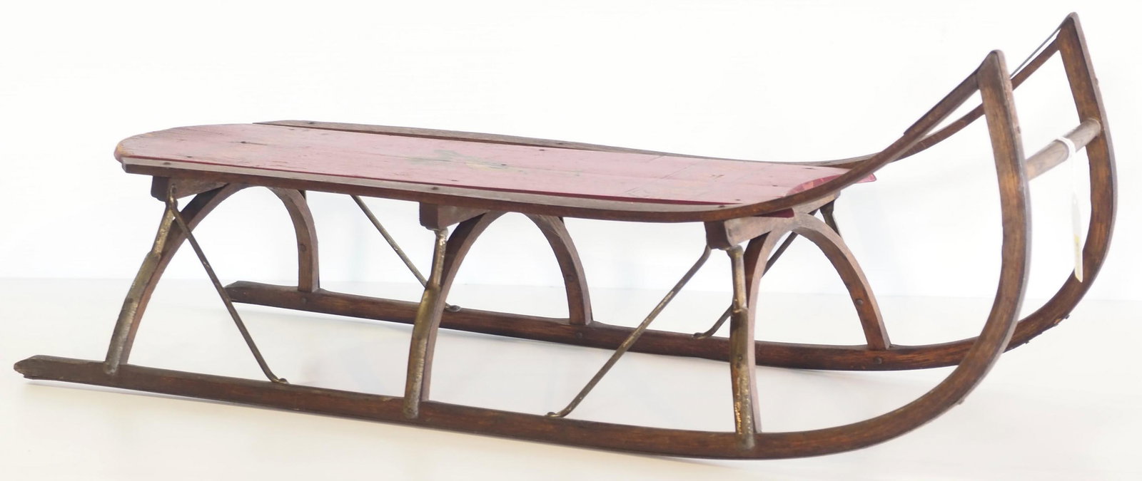 Paris Mfg Co. No.62 wooden child's sled: Paris Mfg Co. No.62 wooden child's sled with bird graphic and nice stenciling * * NOT ELIGIBLE FOR IN-HOUSE SHIPPING. Please contact the auction house for transport options and additional details.