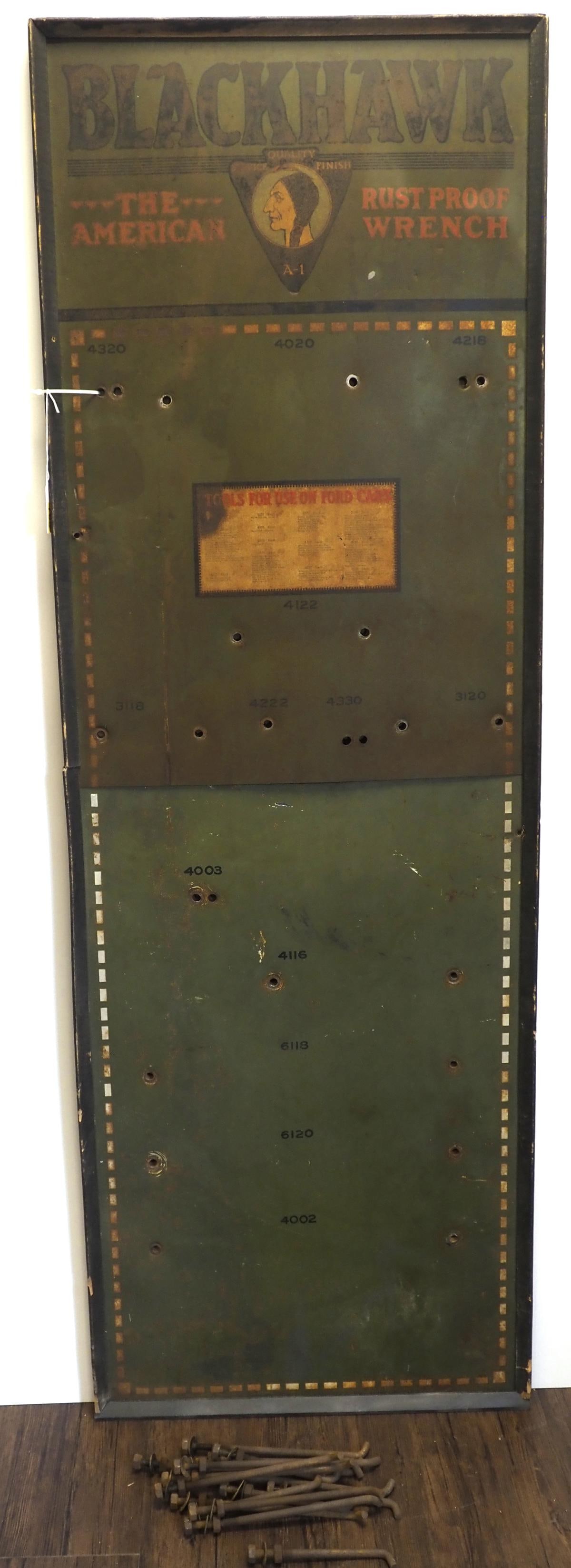 Blackhawk Wrench display sign: 24"x71" SST Blackhawk Wrench display sign with hooks, in wood frame - Fair * * NOT ELIGIBLE FOR IN-HOUSE SHIPPING. Please contact the auction house for transport options and additional details. Items