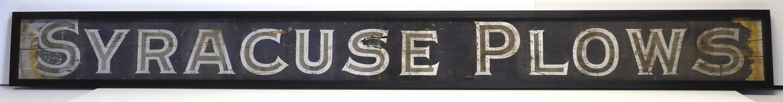 Syracuse Plows sign: 117"x12" wood & sandstone Syracuse Plows sign with wood frame - has been cut in the middle, some paint loss on each end, newer wooden frame * * NOT ELIGIBLE FOR IN-HOUSE SHIPPING. Please contact the