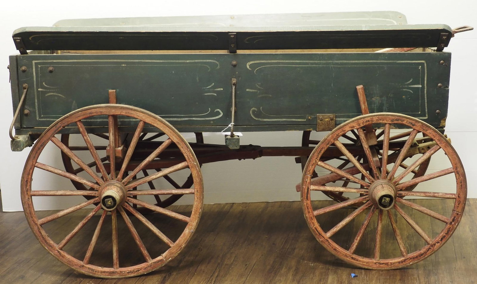 Smaller scale box wagon: Smaller scale box wagon with flared top sideboards and good original green paint and pull handle, 28"W x 66"L x 35"H without handle - Good * * NOT ELIGIBLE FOR IN-HOUSE SHIPPING. Please contact the