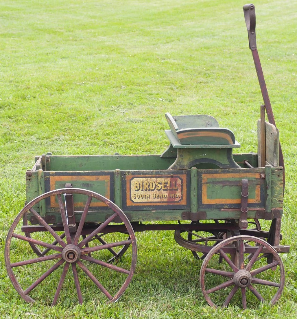 Birdsell, South Bend IND goat wagon: Birdsell, South Bend IND goat wagon with seat and pull handle, good original paint and stenciling * * NOT ELIGIBLE FOR IN-HOUSE SHIPPING. Please contact the auction house for transport options and