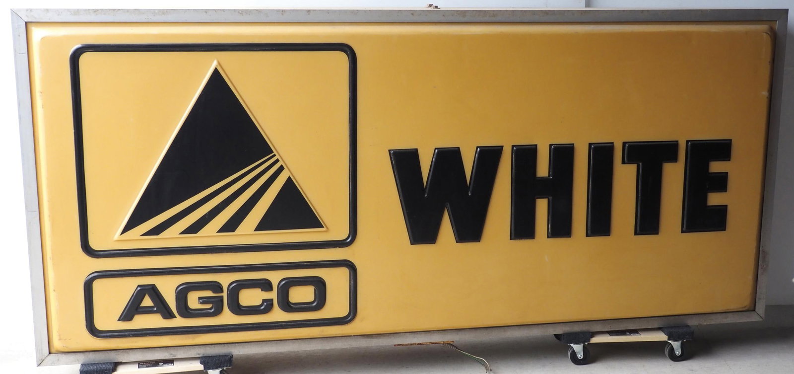 AGCO White lighted sign: 8'x43" metal & plastic AGCO White lighted sign - Untested * * NOT ELIGIBLE FOR IN-HOUSE SHIPPING. Please contact the auction house for transport options and additional details. Items must be picked