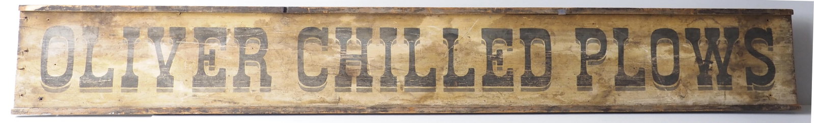 Oliver Chilled Plows sign: 8'x13" wooden painted Oliver Chilled Plows sign - Good original, missing 2 end pieces * * NOT ELIGIBLE FOR IN-HOUSE SHIPPING. Please contact the auction house for transport options and additional deta