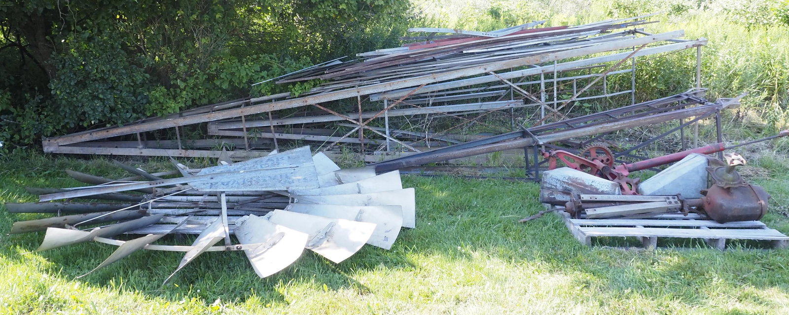 Pile of windmill parts selling for one price!: Pile of windmill parts selling for one price! Including fan, tail, towers, gears and more! One tower is 19'H, fan is 98"dia. * * NOT ELIGIBLE FOR IN-HOUSE SHIPPING. Please contact the auction house