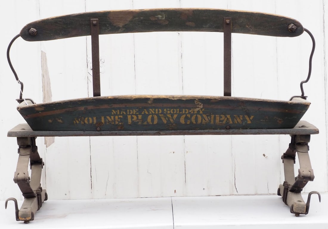 Box wagon seat: Box wagon seat marked Made and Sold By Moline Plow Company, with very good stenciling * * NOT ELIGIBLE FOR IN-HOUSE SHIPPING. Please contact the auction house for transport options and additional deta