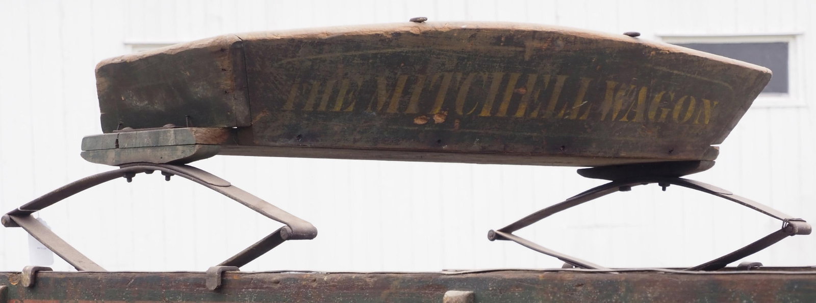 The Mitchell Wagon box wagon seat: The Mitchell Wagon box wagon seat with good paint and stenciling * * NOT ELIGIBLE FOR IN-HOUSE SHIPPING. Please contact the auction house for transport options and additional details. Items must be pi
