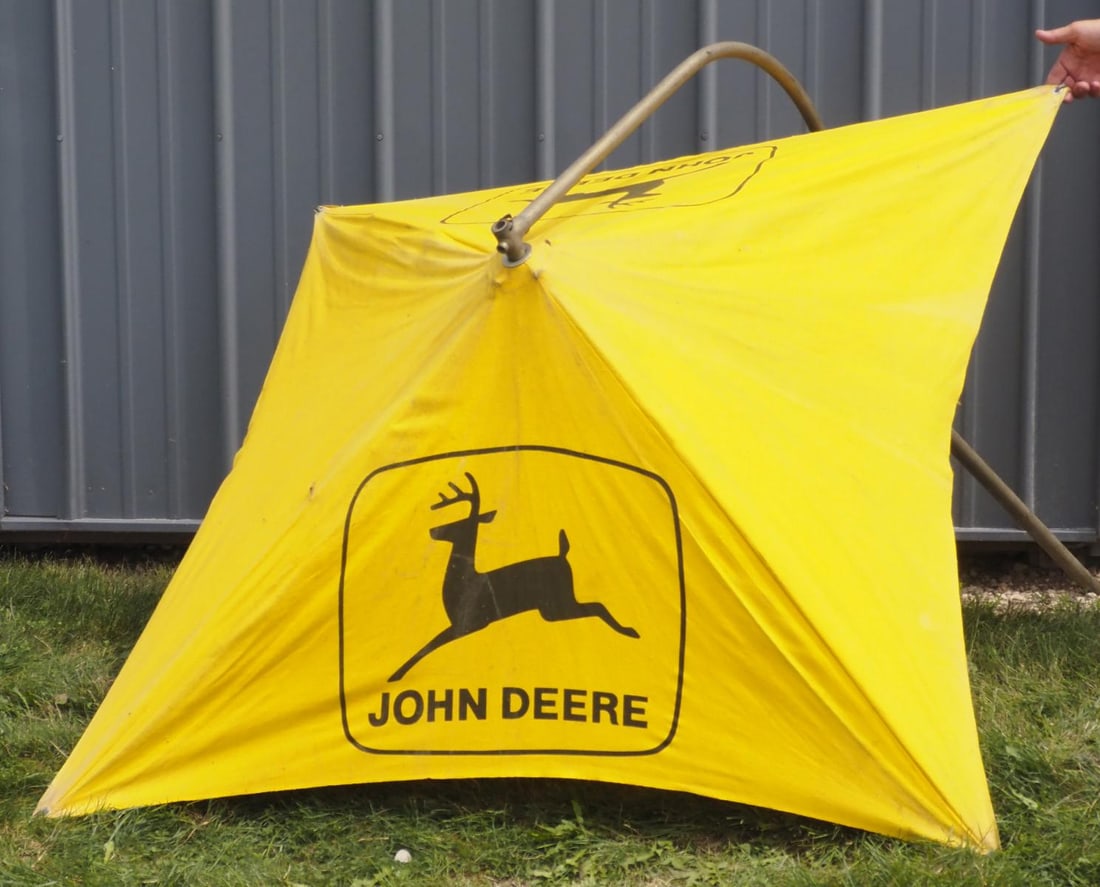 John Deere cloth tractor umbrella with bracket: John Deere cloth tractor umbrella with bracket * * NOT ELIGIBLE FOR IN-HOUSE SHIPPING. Please contact the auction house for transport options and additional details. Items must be picked up within 10