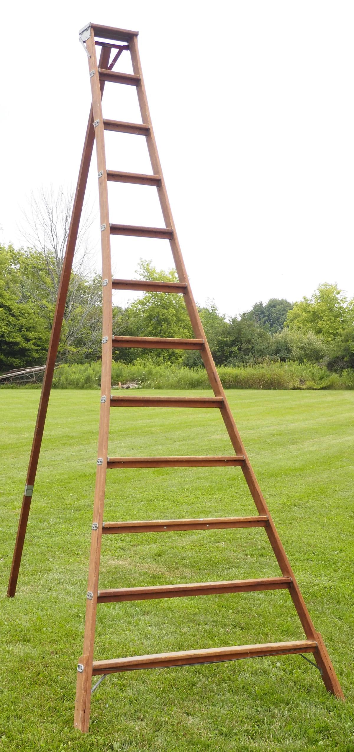 Wooden orchard ladder: Wooden orchard ladder by Columbia Ladder Company with original label, 12'H * * NOT ELIGIBLE FOR IN-HOUSE SHIPPING. Please contact the auction house for transport options and additional details. Items