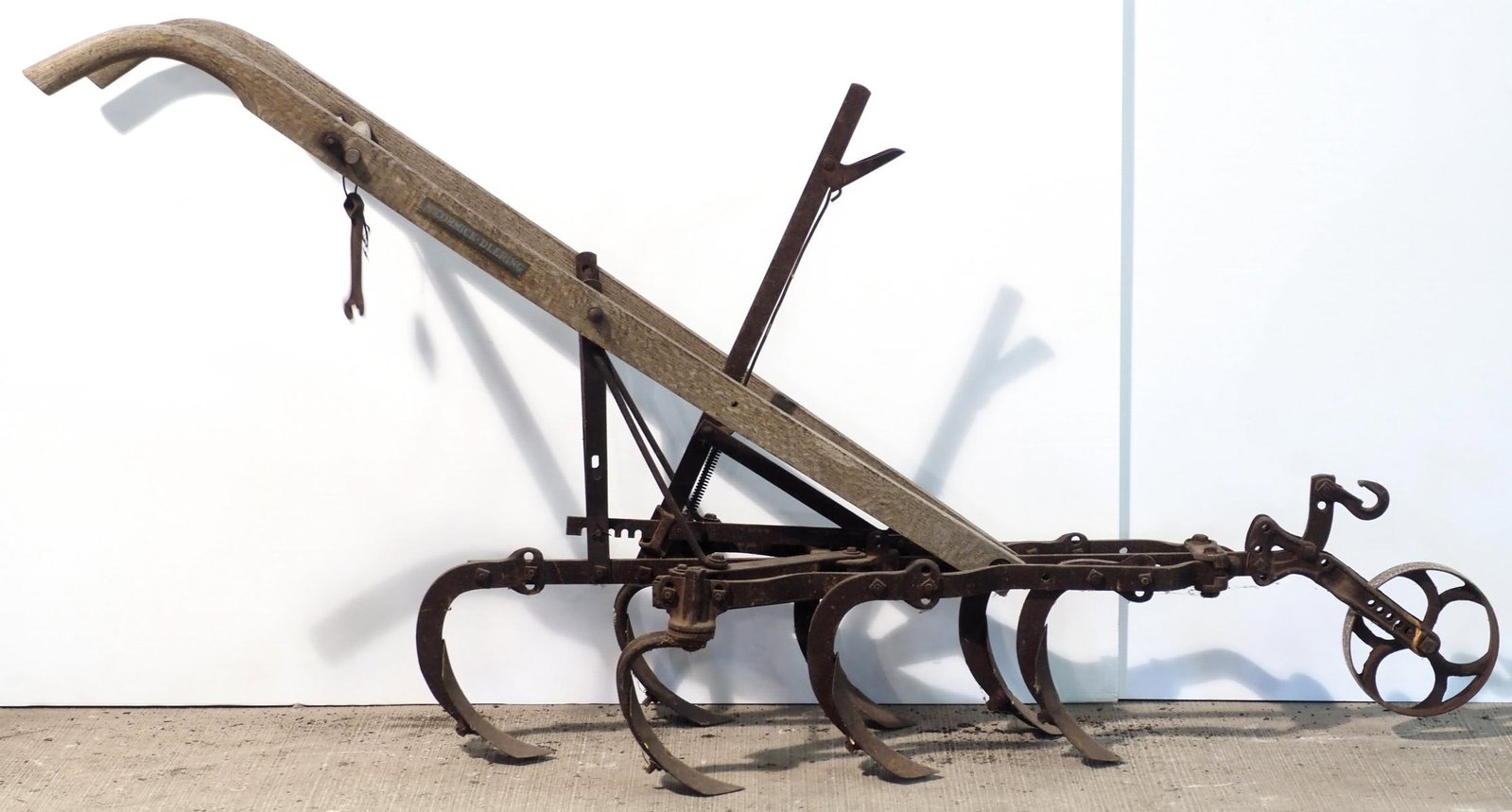McCormick Deering 1-horse walk-behind cultivator: McCormick Deering 1-horse walk-behind cultivator with wrench and good stenciling * * NOT ELIGIBLE FOR IN-HOUSE SHIPPING. Please contact the auction house for transport options and additional details.