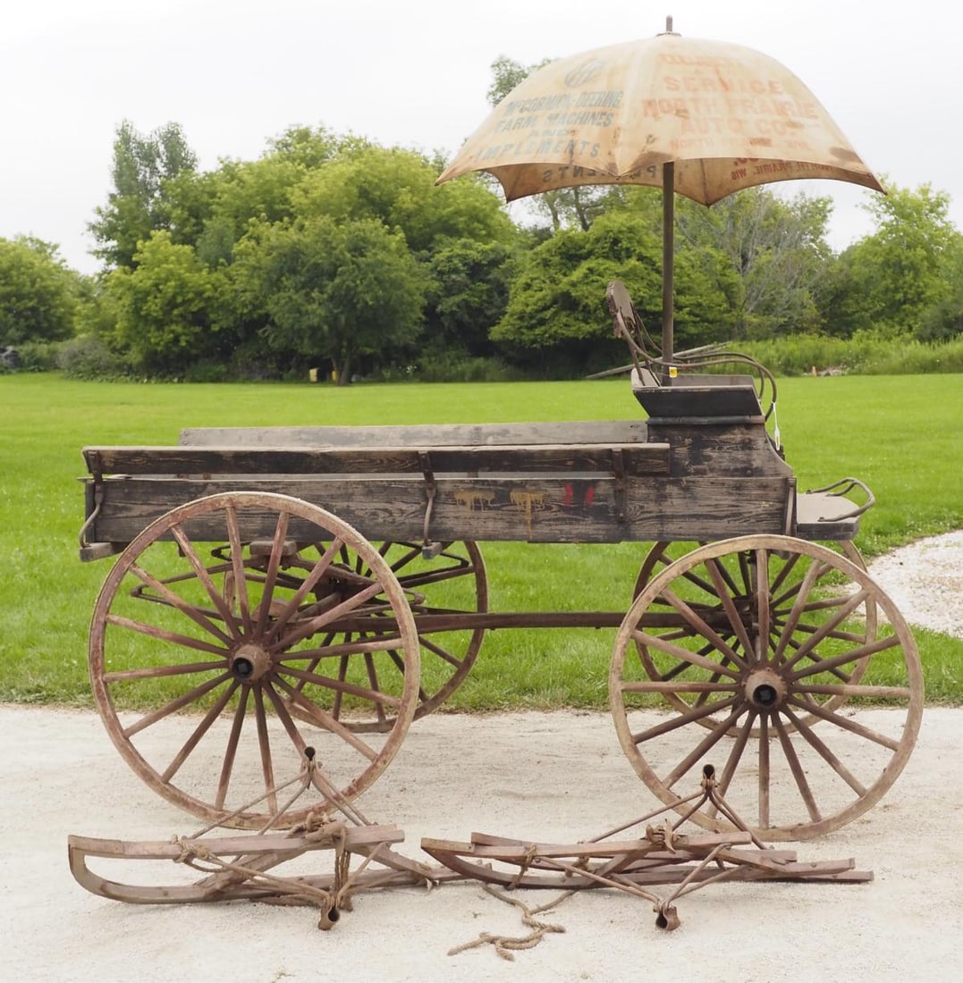 1-horse open wagon with sleigh runners: 1-horse open wagon with sleigh runners, no shafts (umbrella sold separate), 58"W x 8'L x 63"H * * NOT ELIGIBLE FOR IN-HOUSE SHIPPING. Please contact the auction house for transport options and