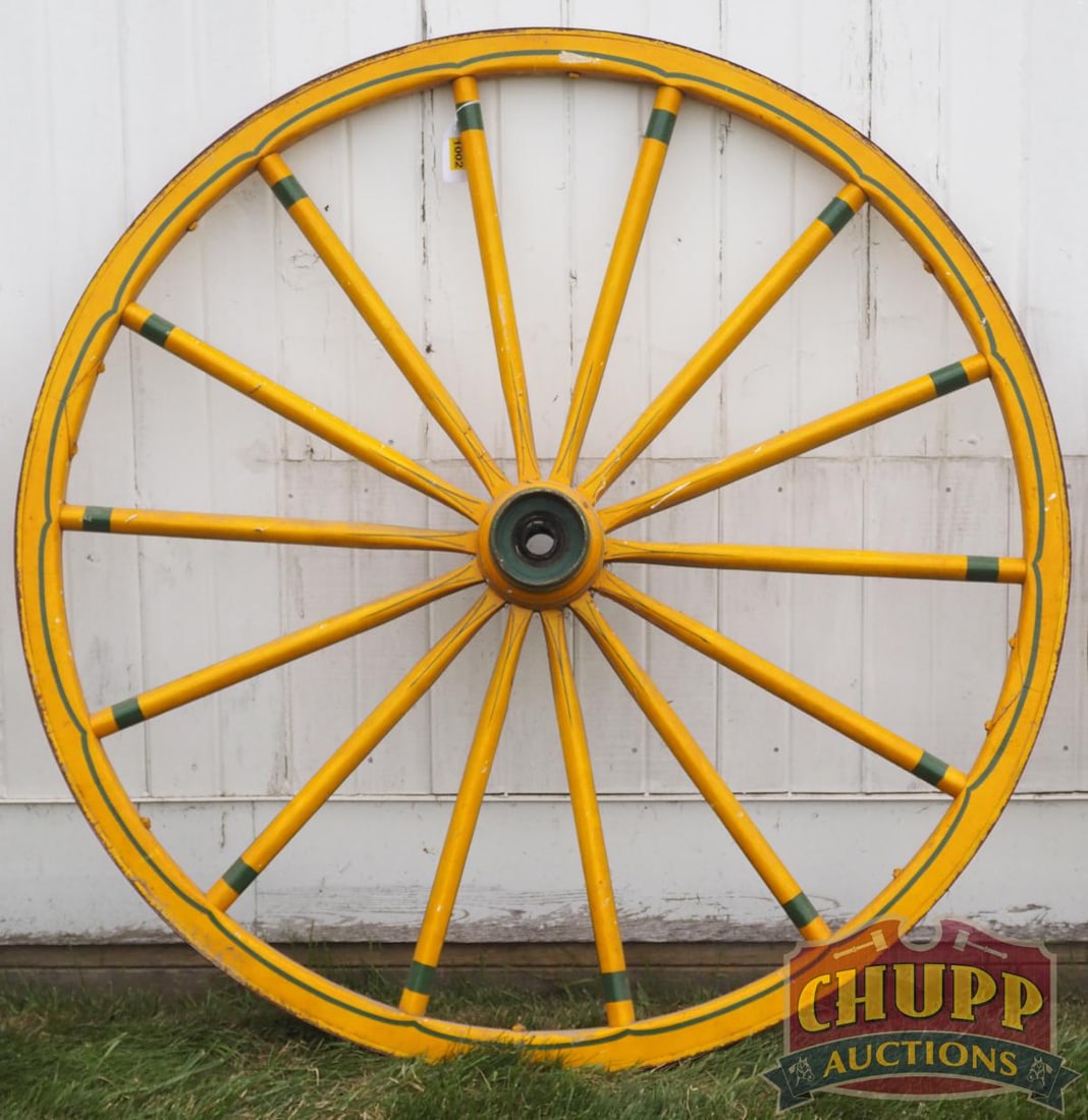 Painted wooden wagon wheel: Painted wooden wagon wheel, 46"dia. * * NOT ELIGIBLE FOR IN-HOUSE SHIPPING. Please contact the auction house for transport options and additional details. Items must be picked up within 10 business da