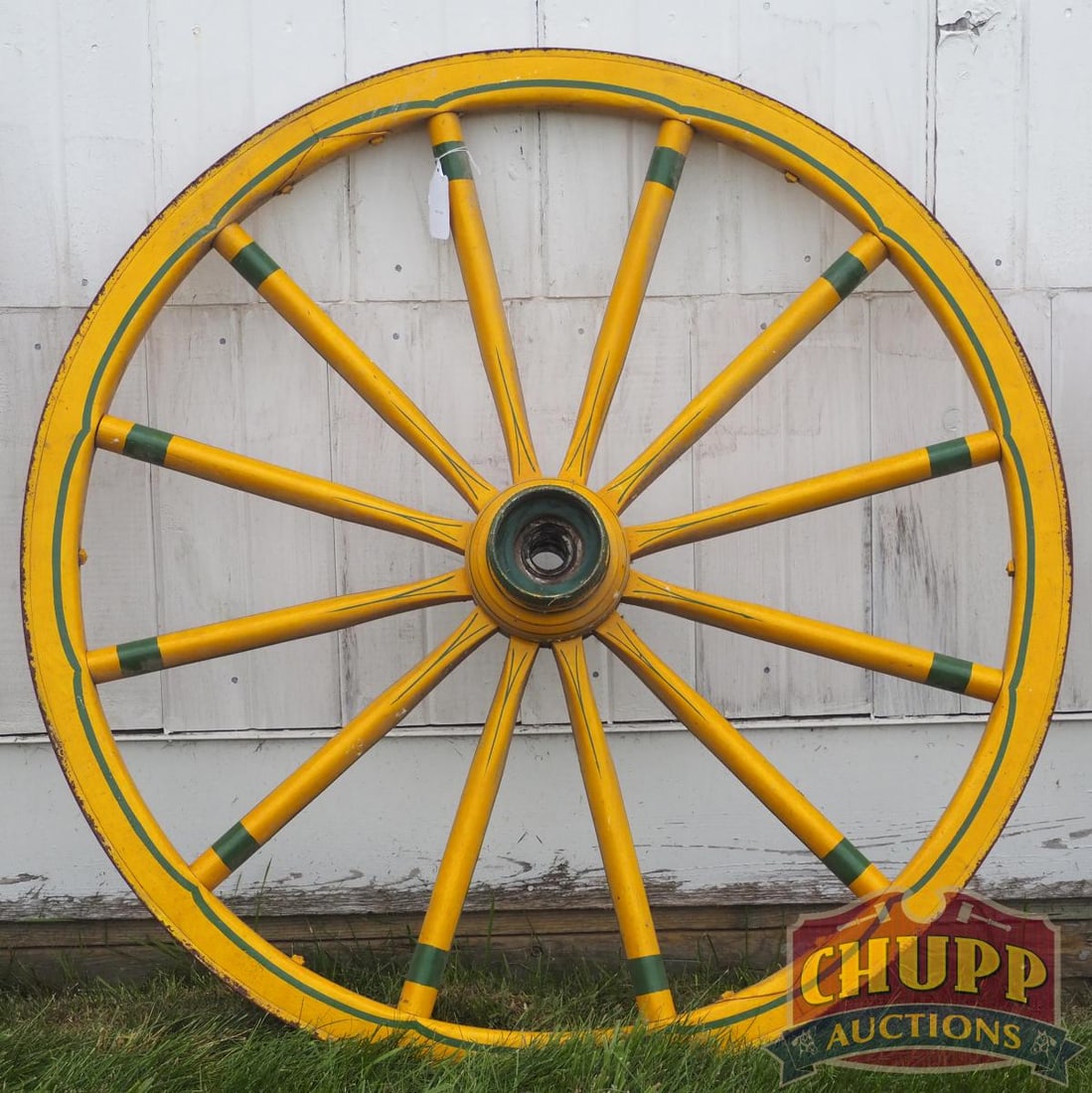 Painted wooden wagon wheel: Painted wooden wagon wheel, 37"dia. * * NOT ELIGIBLE FOR IN-HOUSE SHIPPING. Please contact the auction house for transport options and additional details. Items must be picked up within 10 business da