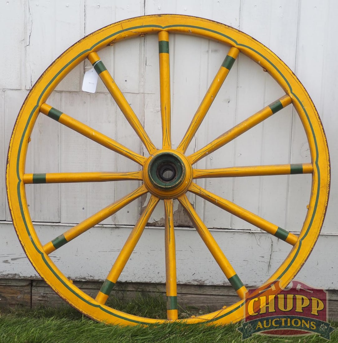 Painted wooden wagon wheel: Painted wooden wagon wheel, 37"dia. * * NOT ELIGIBLE FOR IN-HOUSE SHIPPING. Please contact the auction house for transport options and additional details. Items must be picked up within 10 business da