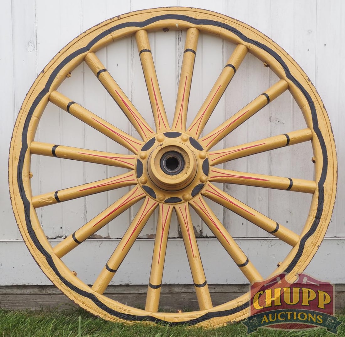Painted wooden wagon wheel: Painted wooden wagon wheel, 46"dia. * * NOT ELIGIBLE FOR IN-HOUSE SHIPPING. Please contact the auction house for transport options and additional details. Items must be picked up within 10 business da