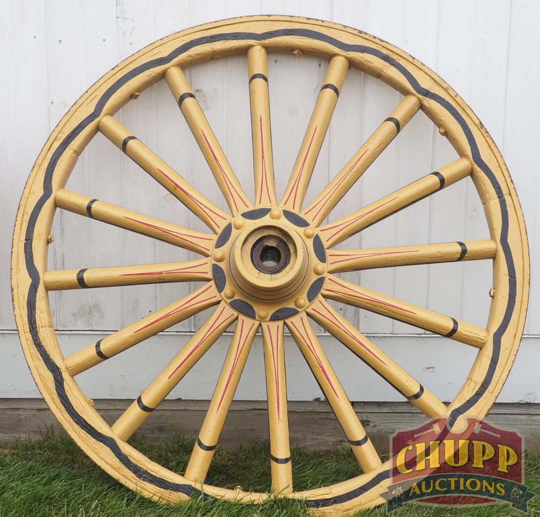 Painted wooden wagon wheel: Painted wooden wagon wheel, 46"dia. * * NOT ELIGIBLE FOR IN-HOUSE SHIPPING. Please contact the auction house for transport options and additional details. Items must be picked up within 10 business da