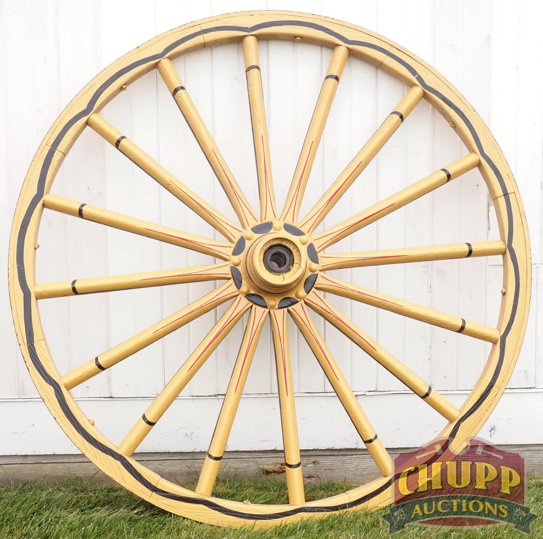 Painted wooden wagon wheel: Painted wooden wagon wheel, 60"dia. * * NOT ELIGIBLE FOR IN-HOUSE SHIPPING. Please contact the auction house for transport options and additional details. Items must be picked up within 10 business da