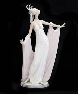 Lladro Porcelain Figurine Grand Dame #1568: Lladro Porcelain Figurine Grand Dame #1568. The figurine beautifully depicts a 1920's era dame in floor length dress doing a grand stance. Marked to the underside base. Weight Approx., 3.5 lbs.