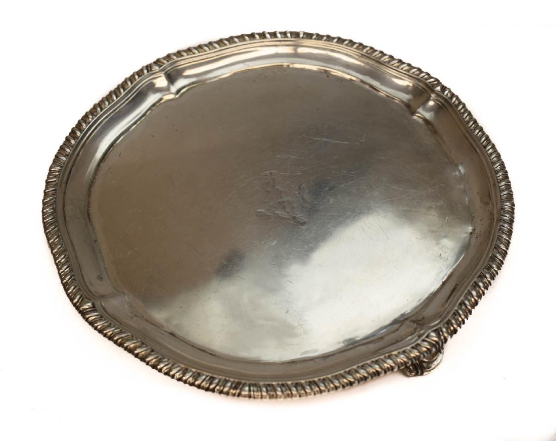 John Parker I Edward Wakelin Silver Tray Salver: John Parker I & Edward Wakelin George III London sterling silver footed tray salver , 1772. Hand chased indistinguishable armorial crest to the center. Braided texture rim along the edge. John Parker